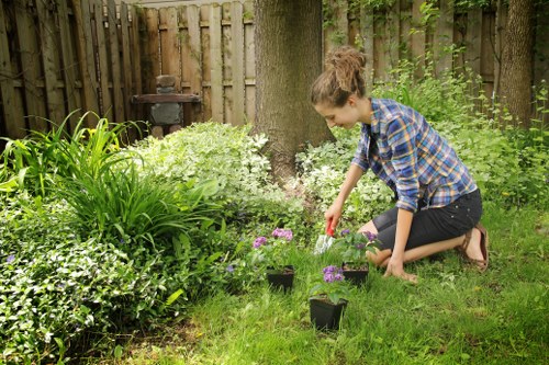 Happy homeowner enjoying a well-maintained garden